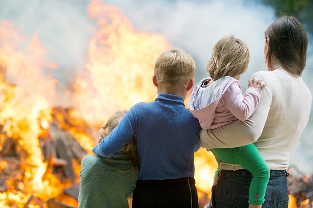 220431301 featured image People watching large outdoor fire together