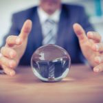 Trump Unleashes Groundbreaking Vision for America’s Defense Man in suit reaching for crystal ball