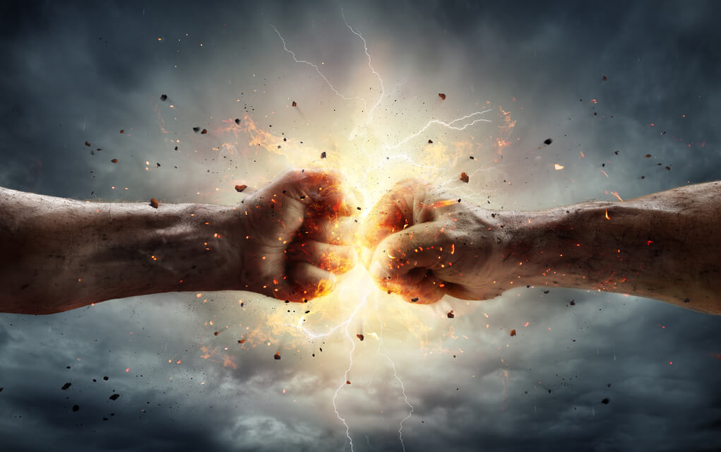 Two fists colliding with sparks and debris.