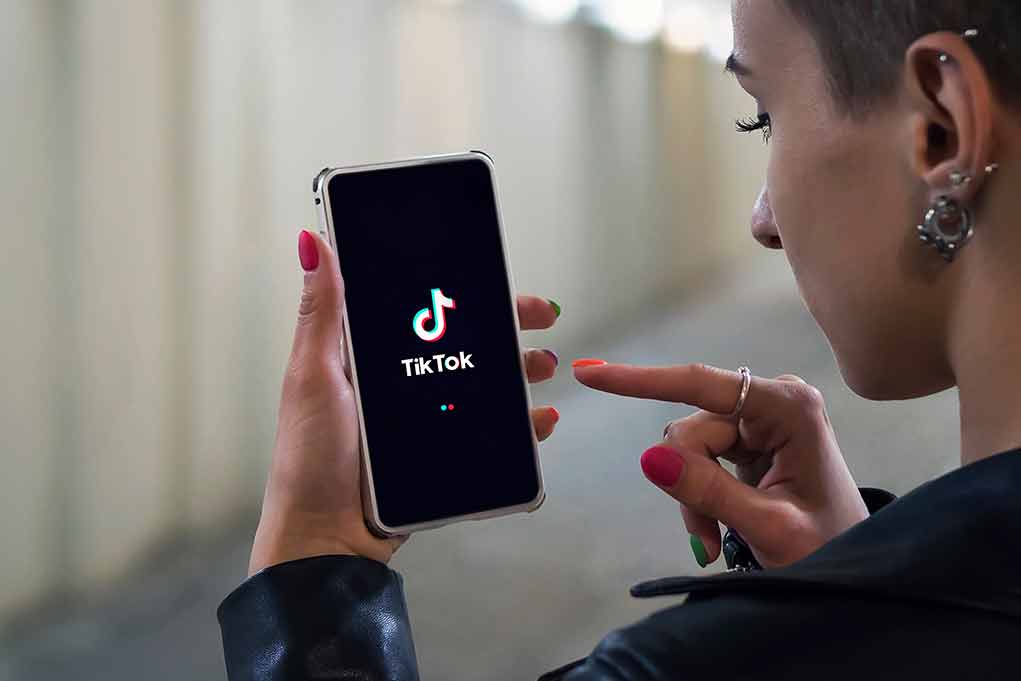 1795552729 featured image Person using TikTok app on smartphone