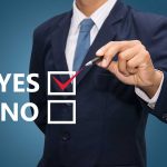 Senate’s Polarizing Vote – Stakes Couldn’t Be Higher Man in suit selecting yes with pen