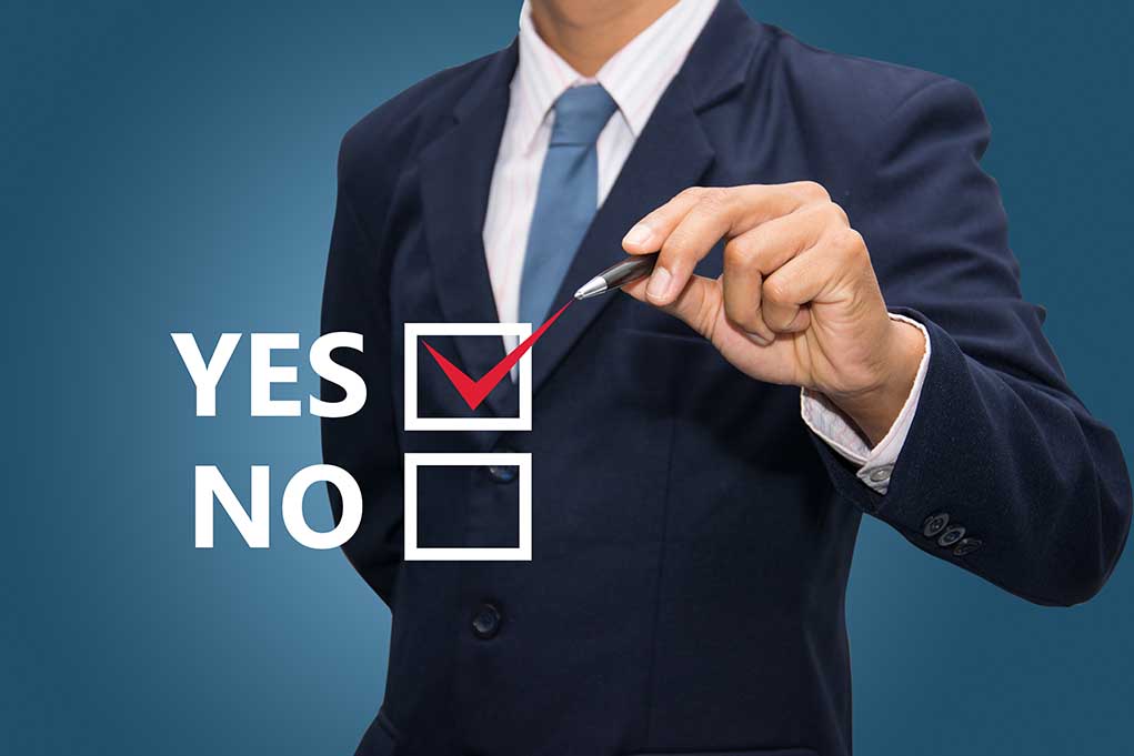 20385632 featured image Man in suit selecting yes with pen