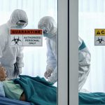 Protect Yourself from THIS Superbug – Key Questions to Ask Your Doctor Healthcare workers in protective gear in quarantine room.