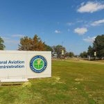 The FAA’s Urgent Gamble to Secure Our Airspace Federal Aviation Administration sign on grassy lawn.