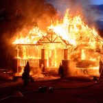 Fireproof Your Future – The House That Could Save Your Life House engulfed in flames with firefighters present