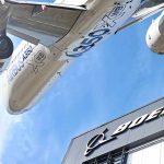 After Deadly Crashes – Boeing’s CEO Finally Breaks His Silence Airbus plane flying over Boeing building.