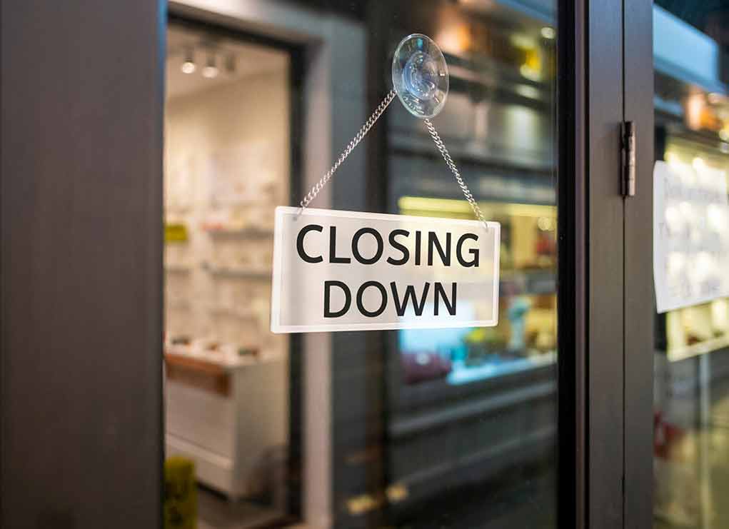 closing down sign on glass door