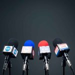 Four microphones in a row for broadcasting