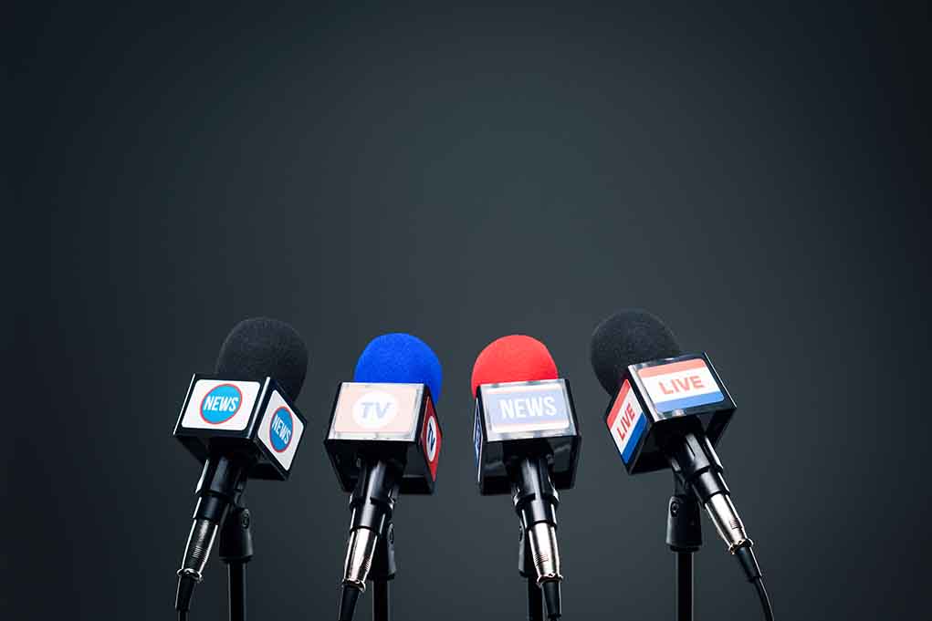 Four microphones in a row for broadcasting