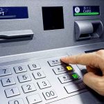 This Tiny Slip of Paper Can Harm You Person pressing button on an ATM keypad