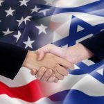 Handshake in front of US and Israeli flags