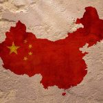 Map of China with flag on textured wall