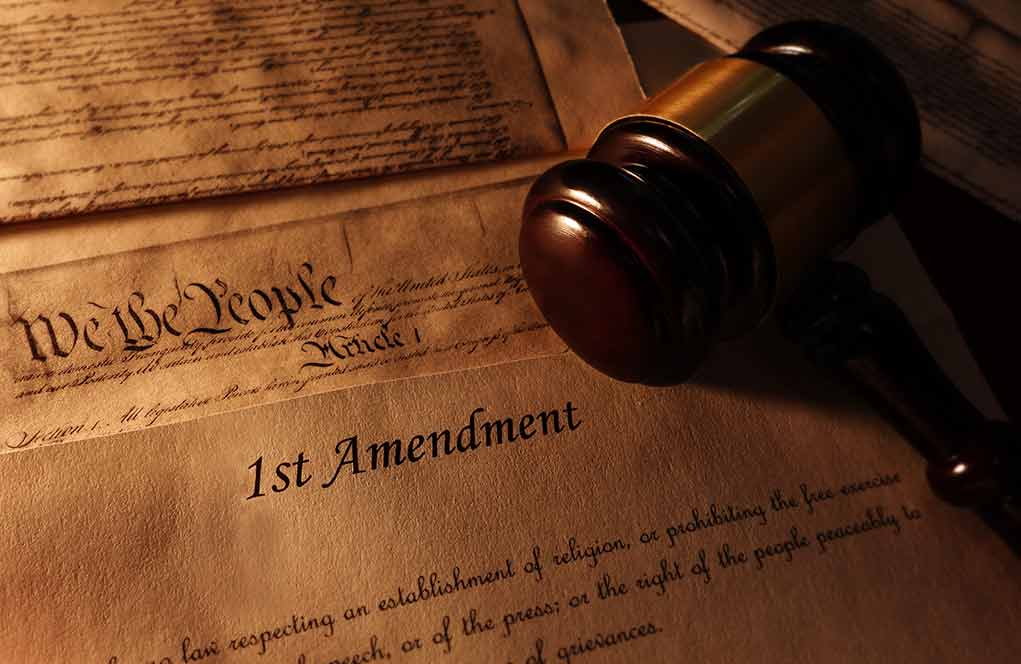 First Amendment document with gavel and Constitution background