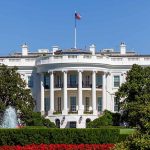 Behind the Scenes of a Tense Diplomatic Rescue in Belarus White House with gardens and fountain in foreground