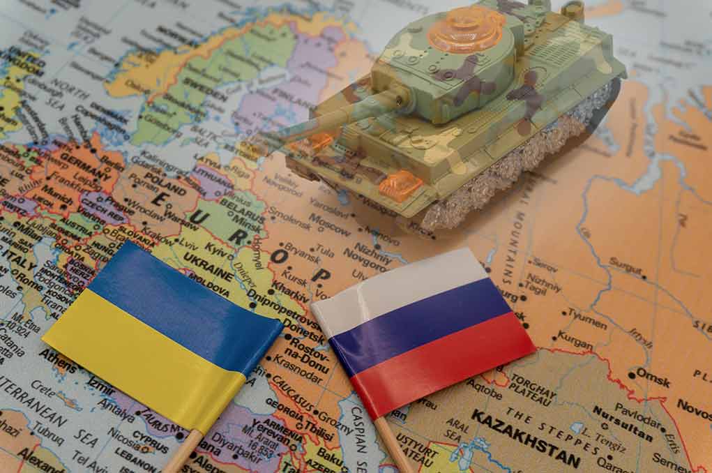 Tank on map with Ukraine and Russia flags