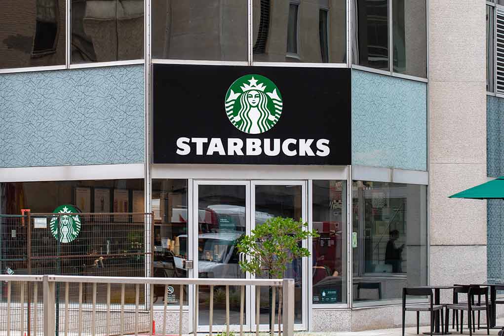 Starbucks storefront with glass doors and logo