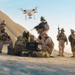 Inside the US Army’s Bold Move: Drones with Electromagnetic Sensors Soldiers operating drone in desert landscape with equipment