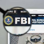 Satanic Scare 2.0: Are We Witnessing a Revival of 1980s Panic? Magnifying glass over FBI logo on webpage