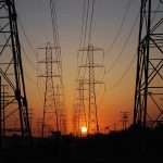 Spain’s Blackout Raises Questions About Renewable Energy Limits Transmission towers at sunset