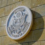 United States of America embassy emblem on wall