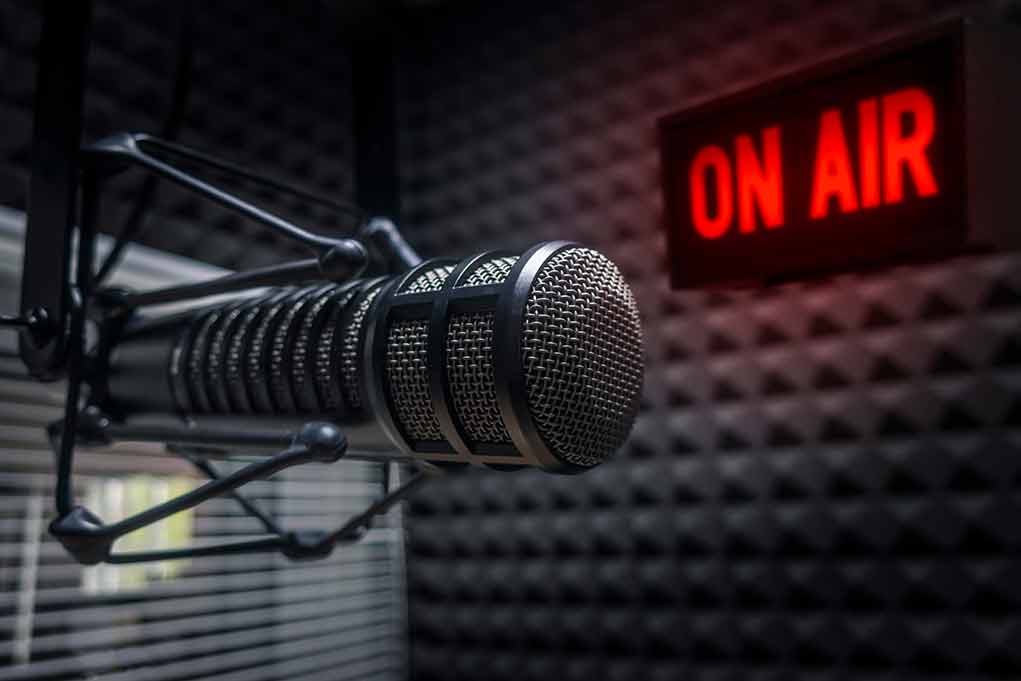 Microphone in studio with On Air sign