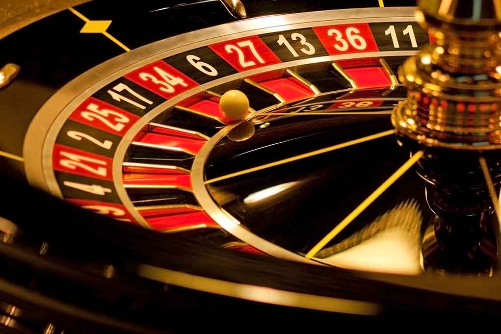 Closeup of roulette wheel with spinning ball