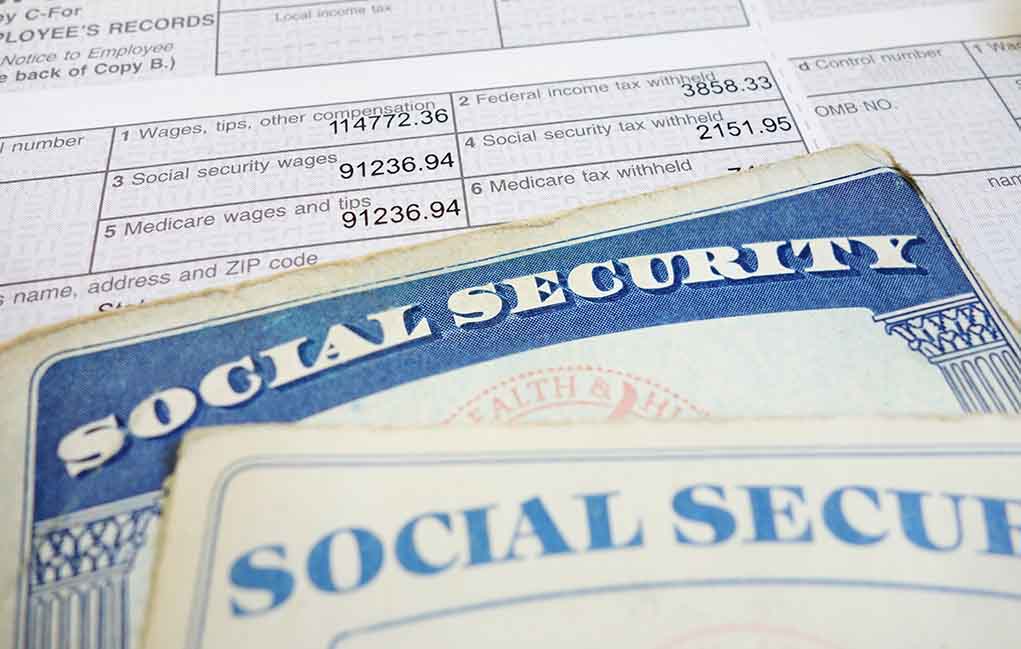 Social security cards on top of tax documents
