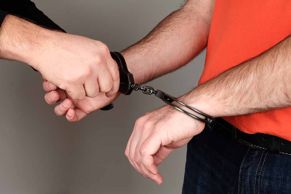 Person handcuffing another persons wrists