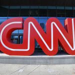 Media Watchdogs WARN: Propaganda On the Rise Large red CNN sign outside building entrance