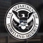 Mayor Compared ICE to Nazis – What Now? US Department of Homeland Security emblem on wall