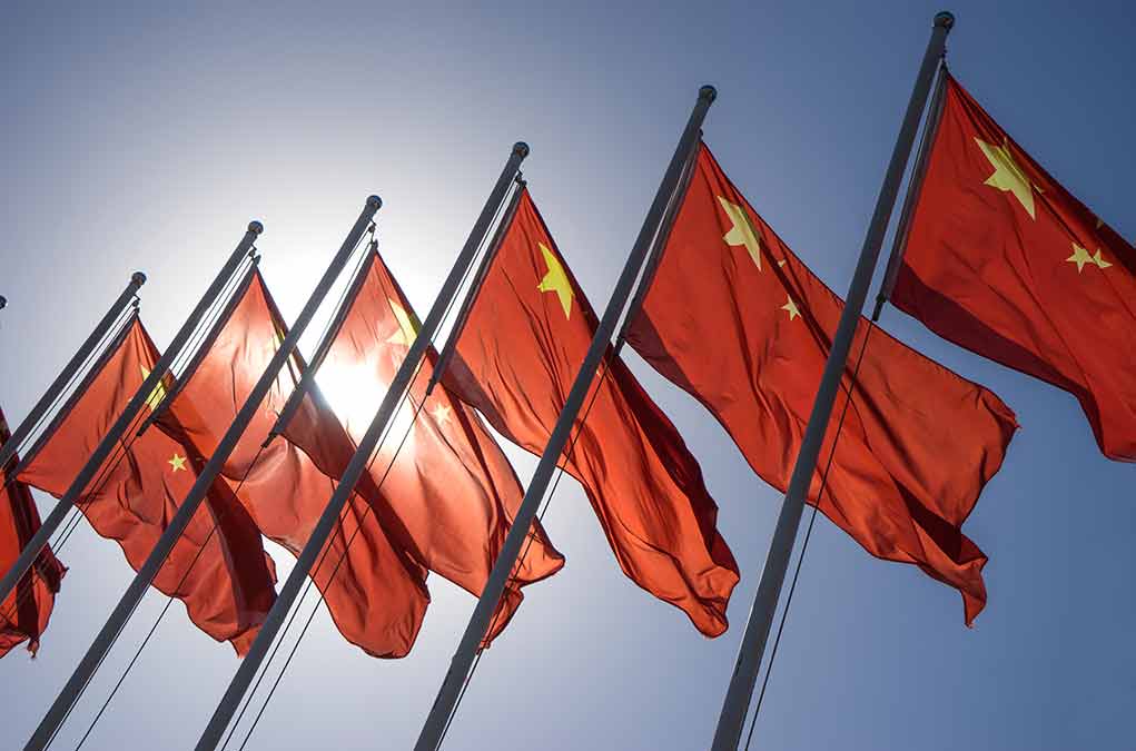 325058183 featured image Red flags with yellow stars on flagpoles