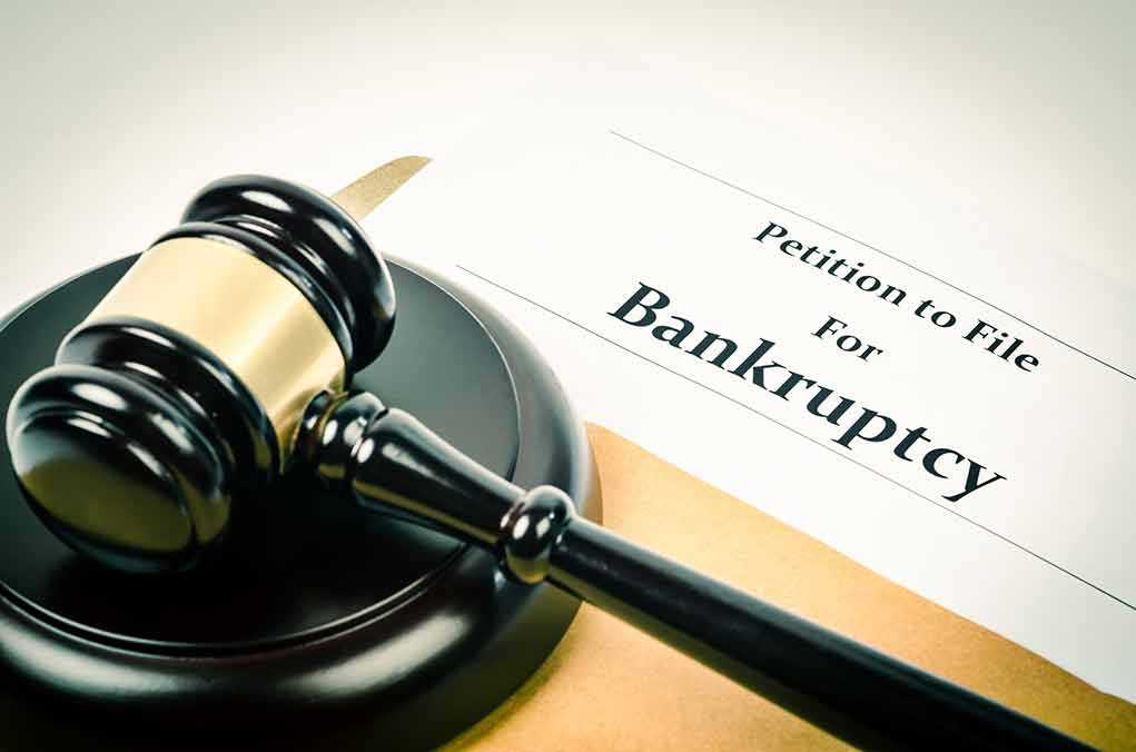 Gavel on bankruptcy petition document