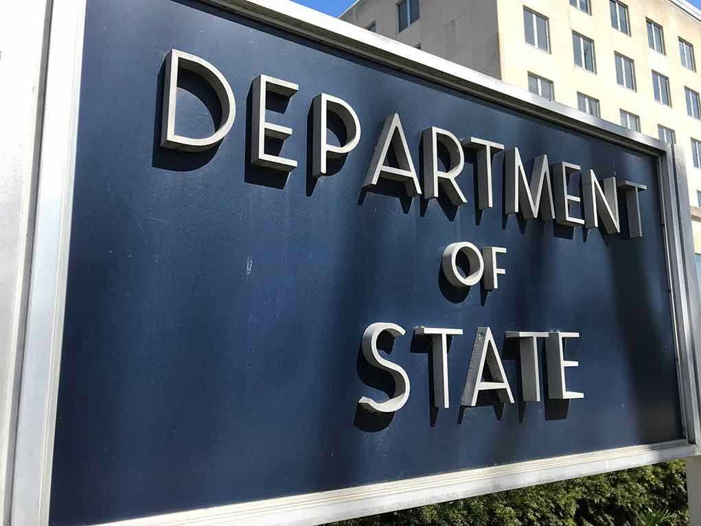 Department of State sign in front of building