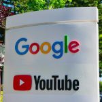 AI Power Play: Google Grabs OpenAI Google and YouTube sign with trees in background