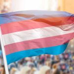 FTC Drops BOMBSHELL on Transgender Medicine Transgender pride flag waving at outdoor event