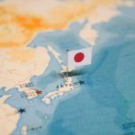 Tariff BOMBSHELL Shocks Japan, Korea—Allies Furious Map of Japan with flag pin placed nearby