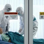 First Human Screwworm Case – What Next for U.S.? Healthcare workers in protective gear in quarantine room.
