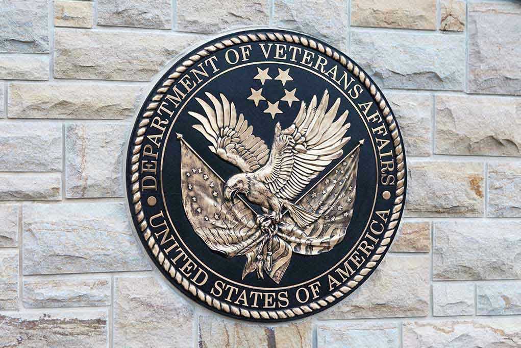Department of Veterans Affairs seal on brick wall