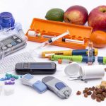 Diabetes management tools with fruits and nuts displayed