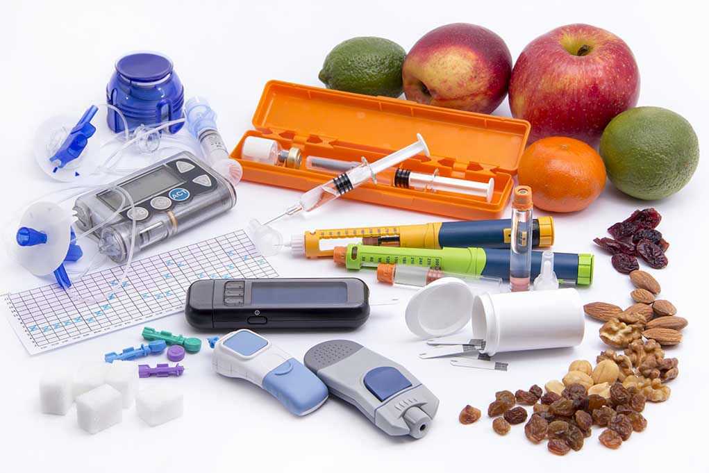Diabetes management tools with fruits and nuts displayed