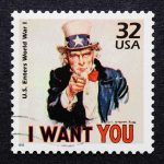 Vintage stamp featuring Uncle Sam pointing with the text I WANT YOU