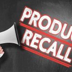Shocking Cinnamon Recall: 12 Brands Contaminated! Person holding megaphone, Product Recall text.