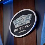 Trump Wants Pentagon RENAMED – Set to Sign Executive Order The Pentagon emblem between two flags.