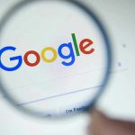 Google Slammed—$425 Million Bombshell Verdict Drops Google logo viewed through a magnifying glass.