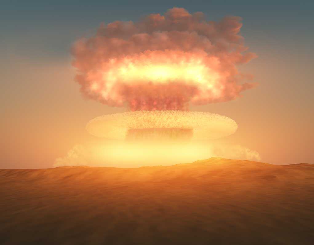 shutterstock_108231338.jpg A nuclear explosion creating a large mushroom cloud against a sunset sky