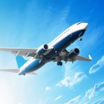 Duct-Taped Passenger Kicks Crew—FBI Stunned An airplane flying against a clear blue sky with clouds