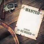 Assassination Aftermath–FBI’s $100K Bounty A vintage wanted poster alongside a revolver and rope on a wooden table