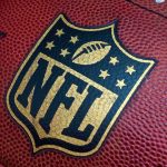 NFL Star Injured — Key Strategy in Jeopardy Close-up of an NFL football with the logo prominently displayed