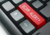 FBI Warns — Seniors Targeted in Fraud Spree Close-up of keyboard with red SCAM ALERT key.