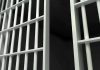 CONVICTED Sex Offender “Accidentally” Released From Prison Close-up of prison cell bars.